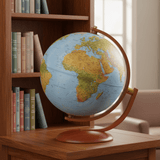 Gibraltar globe placed on a wooden bookshelf, showing correct scale next to hardback books.